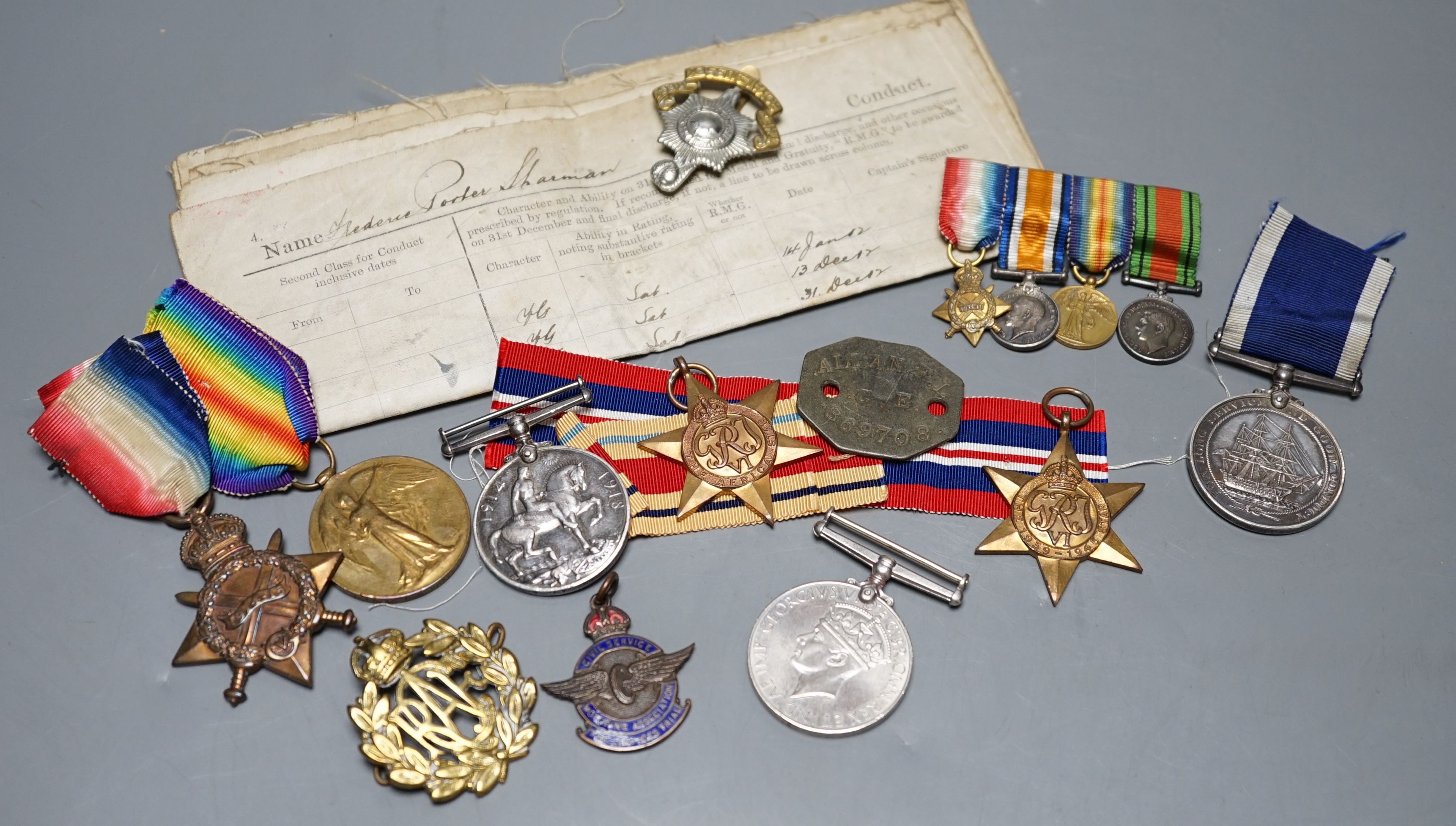 A WWI medal trio awarded to J. 11048 F. P. SHARMAN. A.B. R.N., a George V Royal Navy long service and good conduct medal awarded to M.38014 F. P. SHARMAN. R. P O. H.M.S. REPULSE, a WWI miniature dress medal group, a WWII